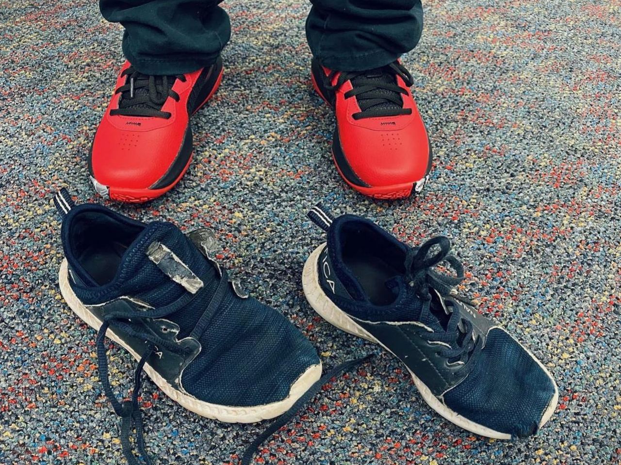 New red sneakers replacing a worn-out pair